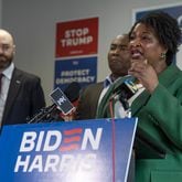 Left to right - State Senator, Josh McLaurin, Chair of the Democratic National Committee, Jaime Harrison, listen to leader, Stacey Abrams during a post presidential debate press conference at at the Biden-Harris campaign office located at 274 Decatur Street SE in Atlanta, one of several in the city. (John Spink/AJC)