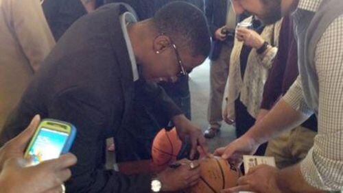 Latonya McMorris autographs basketballs at the Women's Final Four in 2001, where her team -- the Lady Bears of Missouri State, finished in the top four. She says she learned some great skills on the court -- leadership, teamwork, and perseverance. Courtesy of Latonya McMorris