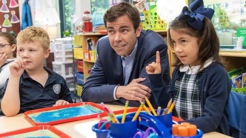 Cornerstone Academy Headmaster Colin Creel (center) watches Katie JohnsonÕs 1st grade class prepare to draw in kinetic sand trays. For the Top Workplace small sized business. PHIL SKINNER FOR THE ATLANTA JOURNAL-CONSTITUTION
Note: he didnÕt want the kids to be identified