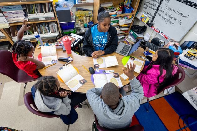 Shamaudie McClendon works with her third grade students on their reading skills at Kimberly Elementary School in Atlanta on Tuesday, Dec. 5, 2023. In the new state budget, Georgia lawmakers inserted nearly $8 million toward literacy mandates they adopted last year. (Steve Schaefer/steve.schaefer@ajc.com)