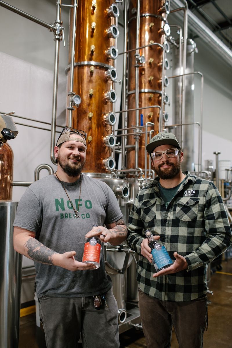 NoFo has distilleries in Cumming and Gainesville. Hyde Buchanan (left) is head distiller and Justin Kendrick is assistant distiller. (Courtesy of Andy Brophy)