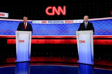 President Joe Biden, right, and Republican presidential candidate former President Donald Trump, left, stand during a break in a presidential debate hosted by CNN, Thursday, June 27, 2024, in Atlanta. (AP Photo/John Bazemore)