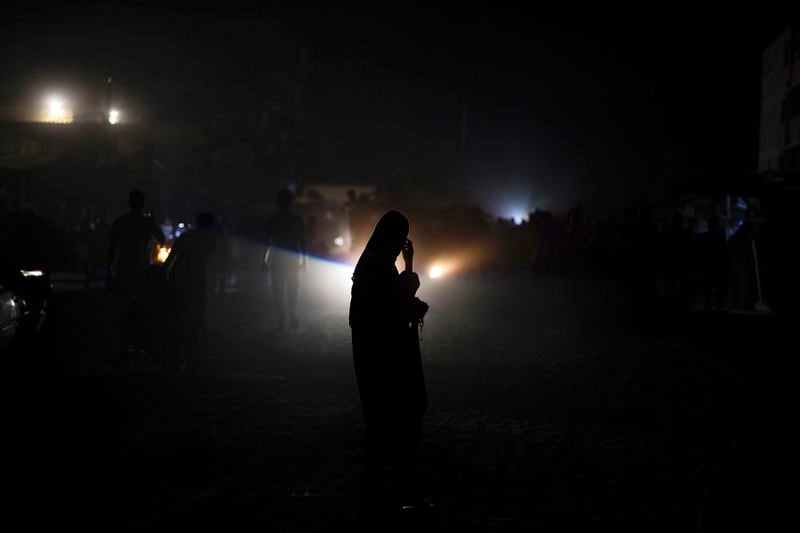 A Palestinian woman displaced by the Israeli air and ground offensive on the Gaza Strip flees from parts of Khan Younis following an evacuation order by the Israeli army to leave the eastern part of Gaza Strip's second largest city on Monday, July 1, 2024. (AP Photo/Jehad Alshrafi)