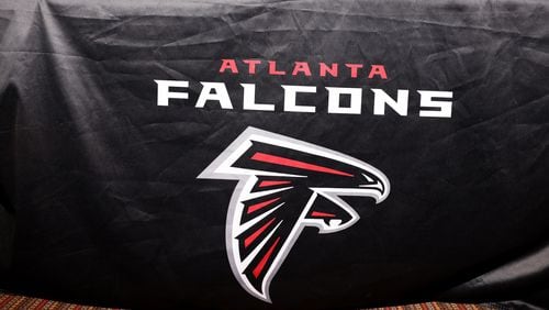 The Atlanta Falcons logo is shown in the media room the day after the first round of the 2022 NFL Draft at the Falcons Practice Facility Friday, April 29, 2022, in Flowery Branch, Ga. (Jason Getz / Jason.Getz@ajc.com)