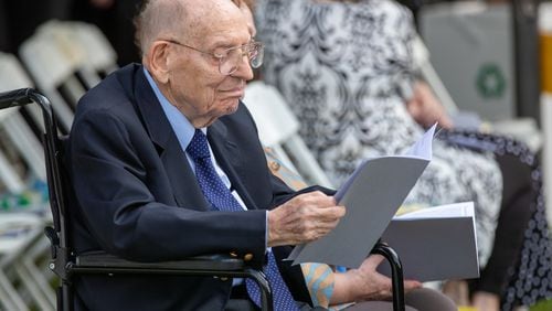 Manning Pattillo, a former Oglethorpe University president, was 102 years old when photographed waiting for the start of the Class of 2022 commencement ceremony. Pattillo helped stabilized the university during his tenure and remained active in supporting it and in many community affairs after his retirement. He died earlier this month. (Steve Schaefer / steve.schaefer@ajc.com)