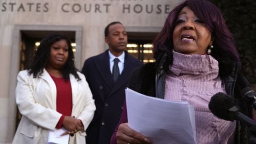 Georgia election workers Ruby Freeman and her daughter, Shaye Moss, speak outside of the  E. Barrett Prettyman U.S. District Courthouse on Friday, Dec. 15, 2023, in Washington, D.C. A jury has ordered Rudy Giuliani, the former personal lawyer for former President Donald Trump, to pay $148 million in damages to the pair. (Alex Wong/Getty Images/TNS)