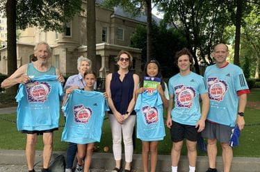 Jere Allen (left) and wife Faye Allen with son Bill (right), daughter-in-law Lisa (center) and their three children after the 2022 AJC Peachtree Road Race.
(Courtesy of Bill Allen)