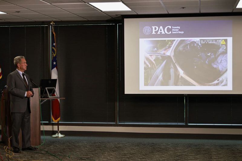 Former Gwinnett County District Attorney Danny Porter shows portions of the surveillance video from the night of Rayshard Brooks' fatal shooting at a news conference Tuesday. Porter, at the request of special prosecutor Pete Skandalakis, reviewed the case against the two Atlanta police officers charged in Brooks' death.