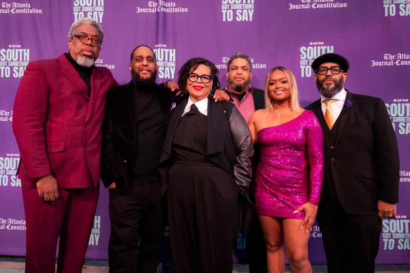 AJC hip-hop documentary filmmakers, (back row, left to right) writer/producer Ernie Suggs, co-director Ryon Horne, Byron Horne, co-director Tyson A. Horne and (front row) supervising producer Sandra Brown and writer/producer DeAsia Paige pose Nov. 2, 2023 outside Center Stage in Atlanta before the premiere of “The South Got Something to Say”.