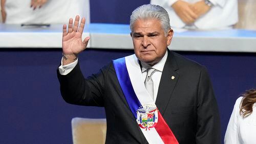 New Panamanian President Jose Raul Mulino waves before giving a speech at his swearing-in ceremony at the Atlapa Convention Centre in Panama City, Monday, July 1, 2024. (AP Photo/Matias Delacroix)