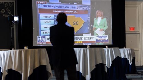 A Haley supporter watches Fox News at Republican presidential candidate Nikki Haley’s primary day watch party at The Charleston Place in Charleston, South Carolina on Saturday, February 24, 2024. The South Carolina primary was one of the earlier primaries in a busy 2024 presidential election season. (Arvin Temkar / arvin.temkar@ajc.com)