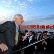 Gerald "Jerry" Grinstein served as Delta Air Lines CEO during the tumultuous years of 2004-07 and helped steer the company out of bankruptcy. He's shown here on Jan. 31, 2007, sprinting to the podium to turn on the "Fly Delta Jets" sign at Hartsfield-Jackson International Airport after it had been turned off for several years. (Rich Addicks/AJC 2007 file)