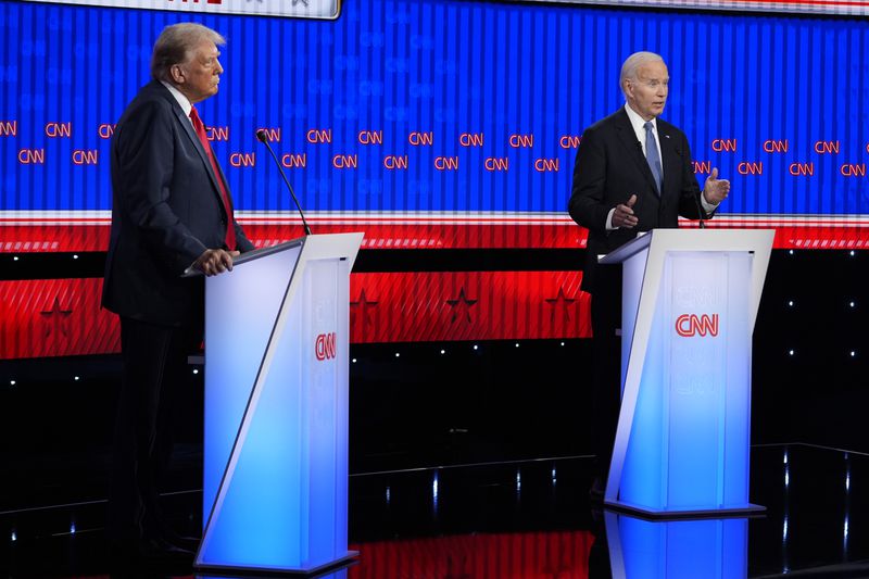 President Joe Biden, right, and Republican presidential candidate former President Donald Trump, left, participate in a presidential debate hosted by CNN, Thursday, June 27, 2024, in Atlanta. (AP Photo/Gerald Herbert)