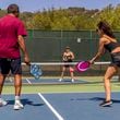 
                        FILE -- Playing pickleball at a tennis club in Fairfax, Calif., Aug. 15, 2022. If pickleball is your main form of exercise, you may need to augment it. There are moves you need to add to age well and avoid injury. (Christie Hemm Klok/The New York Times)
                      