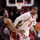 Oklahoma guard Javian McCollum (2) is defended by Houston guard L.J. Cryer (4) during the second half of an NCAA college basketball game Saturday, March 2, 2024, in Norman, Okla. (AP Photo/Garett Fisbeck)