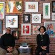 George and Esohe Galbreath pose for a photo in front of their art collection at their home.The couple began collecting art more than ten years ago and now have over 200 pieces in their collection. (Natrice Miller/ Natrice.miller@ajc.com)