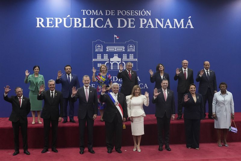 New Panamanian President Jose Raul Mulino, center, poses for a photo alongside his wife and world leaders at his swearing-in ceremony at the Atlapa Convention Centre in Panama City, Monday, July 1, 2024. (AP Photo/Matias Delacroix)