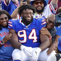 Buffalo Bills defensive tackle Prince Emili (94) sits in the stands following a preseason NFL football game, Saturday, Aug. 13, 2022, in Orchard Park, N.Y. The Bills won 27-24. (AP Photo/Jeffrey T. Barnes)