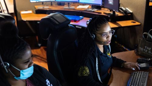 Call takers work at Atlanta’s 911 center in July 2023. (Arvin Temkar / arvin.temkar@ajc.com)