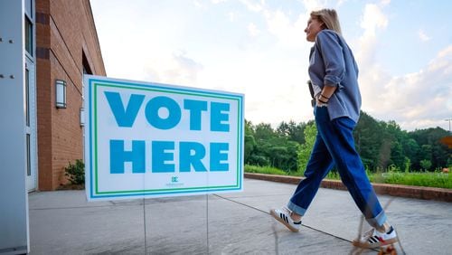 A person walks into the Beuhla Community Family Life Center in Dekalb County after the voting polls opens for the Georgia primary elections on Tuesday, May 21, 2024. (Miguel Martinez / AJC)