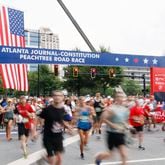 Runners take off at the start of the 54th running of the Atlanta Journal-Constitution Peachtree Road Race in Atlanta on Tuesday, July 4, 2023. Miguel Martinez / miguel.martinezjimenez@ajc.com