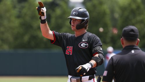 Georgia’s Charlie Condon reacts after hitting a single during the first inning against N.C. State in Game 2 of the NCAA Super Regional at Foley Field, Sunday, June 9, 2024, in Athens, Ga. Georgia won 11-2 to force a deciding Game 3. (Jason Getz / AJC)
