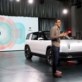 Founder and CEO of Rivian RJ Scaringe speaks onstage during the Rivian Reveals All-Electric R2 Midsize SUV event at Rivian South Coast Theater on March 7, 2024, in Laguna Beach, California. (Phillip Faraone/Getty Images for Rivian/TNS)