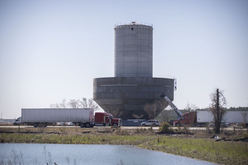 A water tower under construction, center, at the edge of the Hyundai Metaplant site that will be used to hold groundwater pumped from Bulloch County, Wednesday, Feb. 21, 2024, Ellabell, Ga. (AJC Photo/Stephen B. Morton)