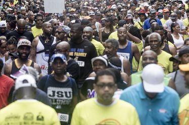 Race participants line up on 10th Street before the start of the 17th Annual Atlanta HBCU Alumni Alliance 5K Run/Walk at Piedmont Park on Saturday morning, June 29, 2024. (Photo Courtesy of Steve Schaefer/Atlanta Journal-Constitution)