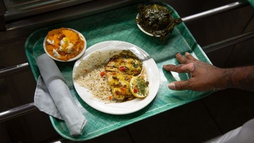 A customer moves down the cafeteria line at Magnolia Room in Tucker. Martha Williams for The Atlanta Journal-Constitution