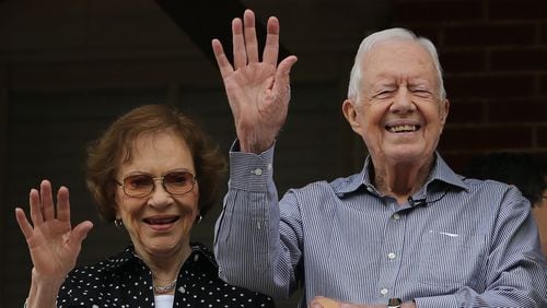 Former President Jimmy Carter and first lady Rosalynn Carter wave to a beauty queen during the Peanut Festival on Saturday September 26, 2015 in Plains. The former president has been in hospice care since February 2023. Rosalynn Carter passed away in November. Ben Gray / bgray@ajc.com