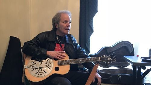 Tommy Talton relaxed with his guitar backstage at the Capricorn Studio Reunion Show in Macon in December 2019. Courtesy Mark Pucci Media.