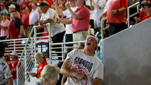 UGA Bulldogs fans react after UGA Bulldogs shortstop Kolby Branch (9) hit a solo home run in the top of the ninth inning to tie the game against Ga Tech during the NCAA Tournament Regional at Foley Field on Sunday, June 2, 2024, in Athens.
(Miguel Martinez / AJC)