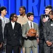Zaccharie Risacher talks with Alex Sarr as they stand on the stage for a group photograph ahead of the first round of the 2024 NBA Draft at Barclays Arena on Wednesday, June 26, 2024 in Brooklyn, NY. (Hyosub Shin / AJC)