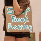 A student holds a sign that reads "Stop Book Banning" at a rally at the Orange County school board meeting in Orlando, Florida, on April 11, 2023. (Carolyn Cole/Los Angeles Times/TNS)