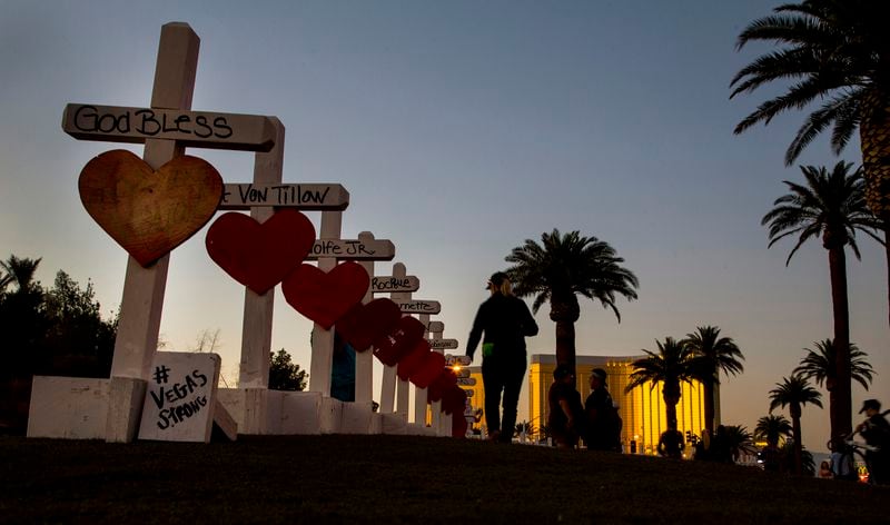 In this file photo, a row of wooden crosses line a street in Las Vegas. They bear the names of those killed during the Oct. 1, 2017, mass shooting there.