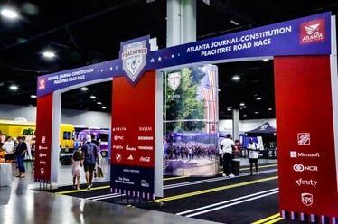 Runners arrive at the 2023 Peachtree Health and Fitness Expo at the Georgia World Congress Center in Atlanta.