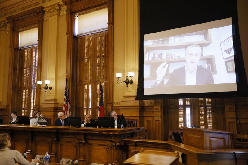 John Poulos, the CEO of Dominion Machines, speaks virtually during a State Election Board meeting at the Georgia Capitol in September 2022. Miguel Martinez / miguel.martinezjimenez@ajc.com 