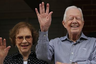 Former President Jimmy Carter and first lady Rosalynn Carter wave to a beauty queen during the Peanut Festival on Saturday September 26, 2015 in Plains. The former president has been in hospice care since February 2023. Rosalynn Carter passed away in November. Ben Gray / bgray@ajc.com