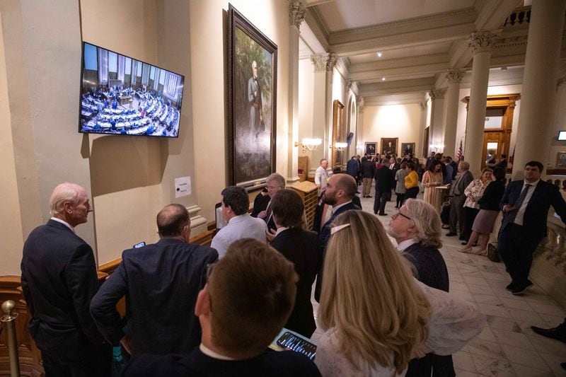 A group of lobbyists watch the sessions on Sine Die, the last day of the General Assembly at the Georgia State Capitol in Atlanta on Monday, April 4, 2022.   Branden Camp/ For The Atlanta Journal-Constitution