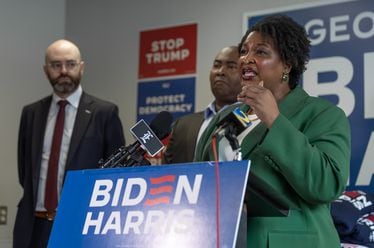Left to right - State Senator, Josh McLaurin, Chair of the Democratic National Committee, Jaime Harrison, listen to leader, Stacey Abrams during a post presidential debate press conference at at the Biden-Harris campaign office located at 274 Decatur Street SE in Atlanta, one of several in the city. (John Spink/AJC)