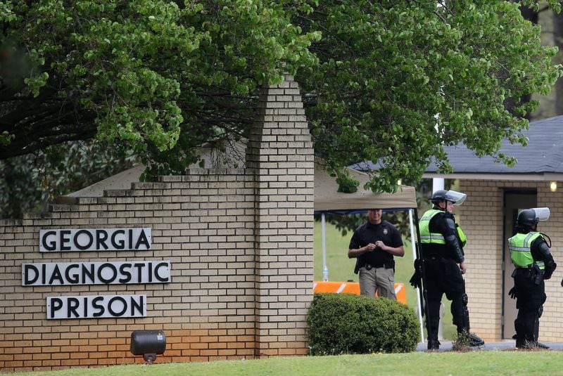Corrections officers guard the entrance to the Georgia Diagnostic and Classification State Prison in advance of the execution of Joshua Bishop on Thursday evening, March 31, 2016. (Ben Gray / bgray@ajc.com)