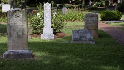 Newly restored headstones stand in Oakland Cemetery's  African-American Burial of grounds Friday, June 10, 2022. The 3.5-acre area within Oakland Cemetery’s 48 acres has not undergone large-scale restoration in more than a century, but thousands of donors pitched in. (Steve Schaefer / steve.schaefer@ajc.com)