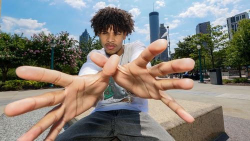 Afro-Latin singer-songwriter Chicocurlyhead, originally from Panama and raised in Atlanta, poses for a photograph at Centennial Olympic Park on Thursday, June 13, 2024. He is set to release his new EP on June 21.
(Miguel Martinez / AJC)