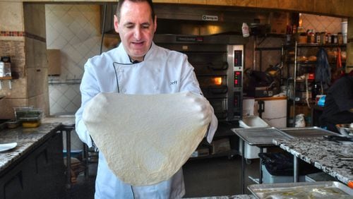 Jeff Varasano stretches the dough for a Margherita pizza. He never tosses the dough, as it makes it tough. Chris Hunt for The Atlanta Journal-Constitution