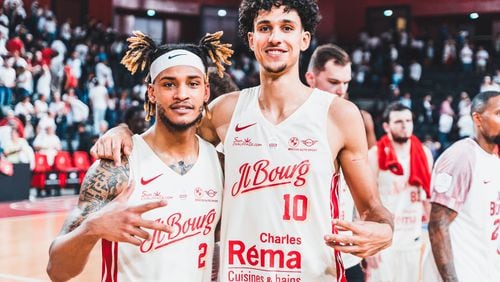 Former Tucker High and Auburn star Bryce Brown (with headband) poses with the Hawks' first overall draft pick Zaccharie Risacher during their time as teammates at JL Bourg in the French professional league in the 2023-24 season. (Photo by Vincent Chabrier/JL Bourg)