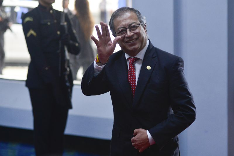 Colombian President Gustavo Petro waves to the press as he arrives at the swearing-in ceremony of Panama's President-elect Jose Raul Mulino at the Atlapa Convention Centre in Panama City, Monday, July 1, 2024. (AP Photo/Agustin Herrera)
