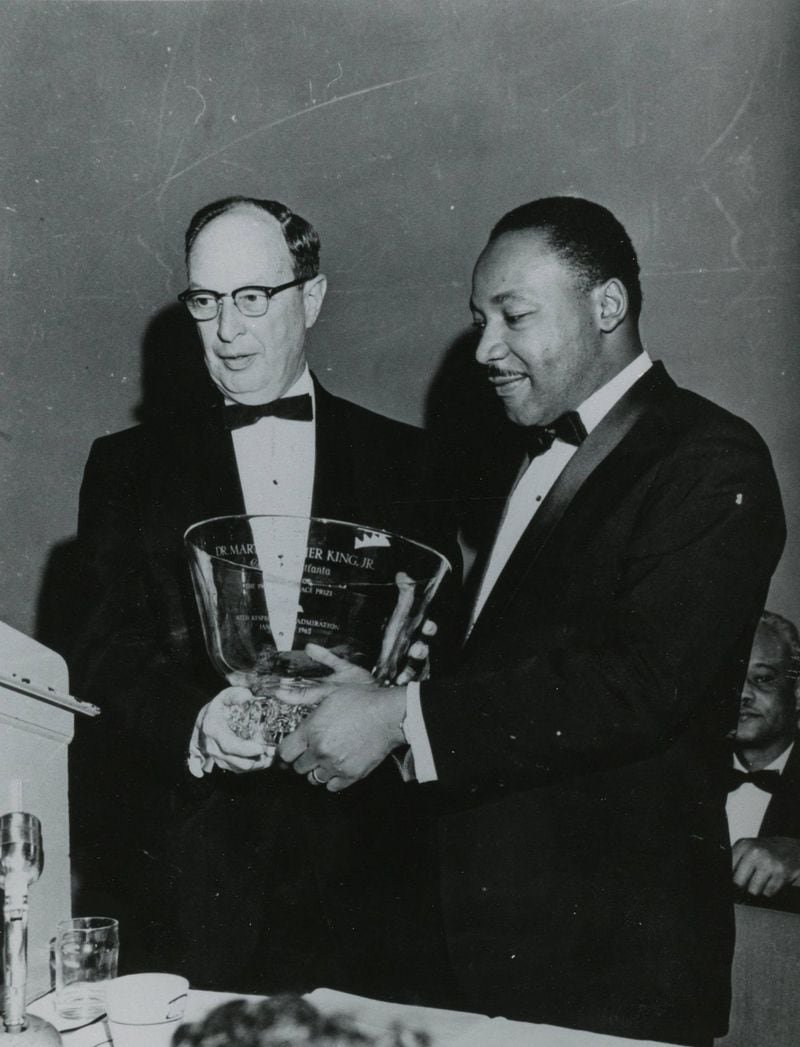 The Rev. Martin Luther King, Jr., with Rabbi Jacob M. Rothschild, at a banquet held at Dinkler Plaza Hotel on January 27, 1965, honoring King for winning the Nobel Peace Prize. LOUIE FAVORITE / AJC FILE
