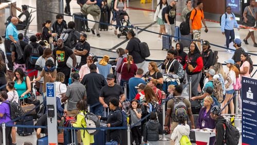 Travelers swelled Atlanta’s Hartsfield-Jackson International Airport on Friday, May 24, 2024. (John Spink/AJC)