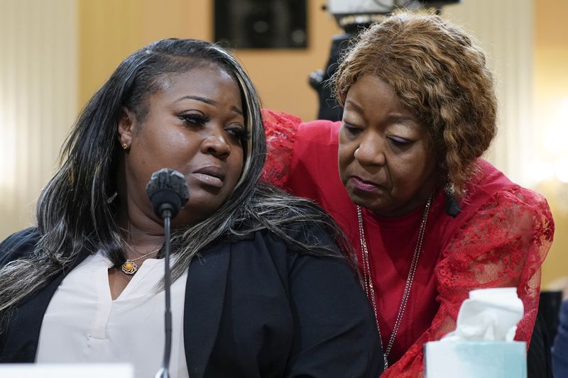 Wandrea "Shaye" Moss, a former Georgia election worker, is comforted by her mother Ruby Freeman, right, at the U.S. Capitol in Washington, Tuesday, June 21, 2022. (AP Photo/Jacquelyn Martin, File)